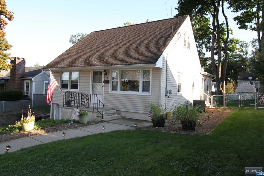 Fantastic 4 bedroom, 2 full bath Cape Cod style home with large family rm/ dining addition with access to the level yard!