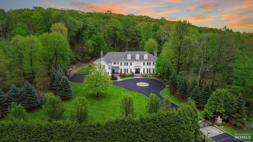 INCREDIBLE VALUE!!! Elegance meets the art of fine living in this breathtaking custom Colonial. Stately set upon 2+ private acres in coveted Franklin Lakes, this immaculate/gated residence offers 4 sprawling floors of pristine living space. Built in 2006, the home blends today's finest finishings with a charm & allure rarely seen today. Offering 7400+ sq. ft. of living-space & adorned with exquisite millwork throughout, the home also boasts an open layout perfect for both living & entertaining, a palatial master suite incl. master retreat/his & her baths/ & private balcony, a fully finished 3rd floor w/ full bath, a stunning cherry office, & so much more. The setting, great school system, & convenient access to highways/shopping/dining & NYC truly make this home one of a kind. Schedule your private tour today.