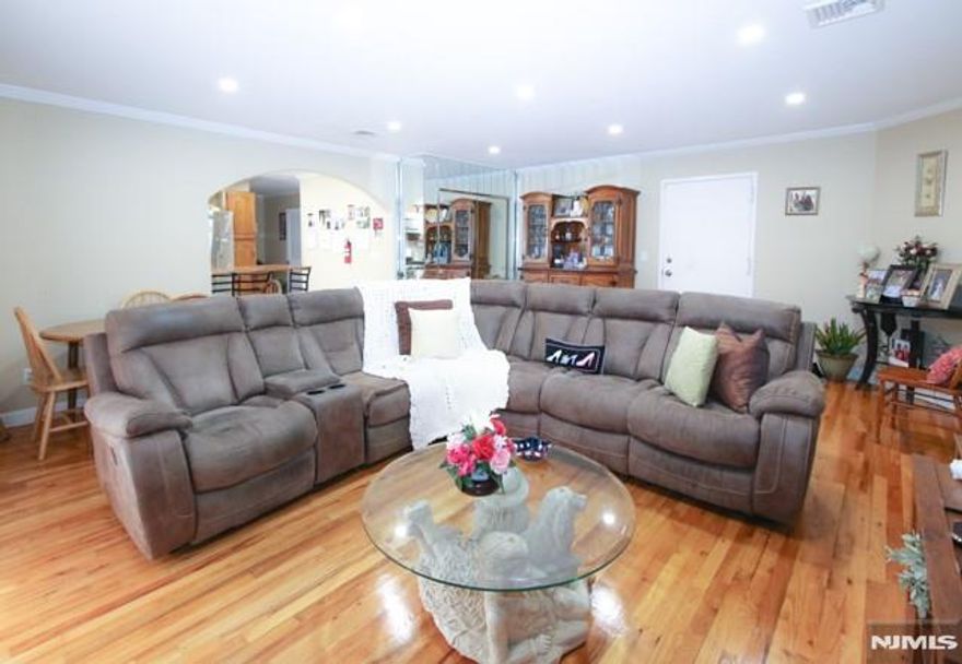 This spacious 2 bedroom 1 bath condominium in the heart of the Ironbound, is on the 1st floor above the its own private 1 car garage!! Brick construction, Hardwood floors throughout, tiled kitchen and baths . It features a living/dining room combo, eat-in kitchen with granite countertops, tile backsplash and stainless appliances, 2 bedrooms, and a full bath. Washer and dryer in unit are included. Gas forced air heat, central air conditioning, separately metered gas, electric & water. Conveniently located to NJ Transit bus #25 to Newark Penn Station and shopping. Limited Pets are permitted. $328 monthly maintenance fee includes snow removal, landscaping, common insurance, common area maintenance and reserves.