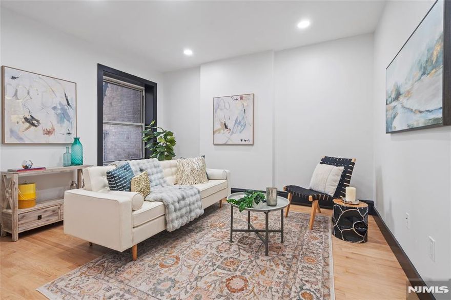 Welcome home to this beautifully renovated 2-bedroom, 1-bathroom apartment at 391 Central Avenue, Unit #3! Situated in the vibrant and convenient Jersey City Heights neighborhood, this residence offers the perfect blend of classic charm and modern upgrades. Step inside and be greeted by gleaming hardwood floors that flow seamlessly throughout the entire apartment. The stylish kitchen boasts elegant shaker cabinets, providing ample storage and a sophisticated touch. You'll appreciate the convenience of an in-unit washer and dryer, making laundry day a breeze. The thoughtful design extends to the details, with striking black trim adding a contemporary edge to the space. Beyond the apartment itself, you'll also benefit from extra storage space located in the basement â€“ perfect for stowing away seasonal items and more. Located on Central Avenue, you'll find yourself surrounded by an array of local shops, restaurants, and cafes. Enjoy easy access to public transportation, making your commute to NYC and other parts of New Jersey a cinch. Don't miss this opportunity to live in a beautifully appointed apartment in one of Jersey City's most desirable neighborhoods! Schedule your showing today. Parking available nearby for an additional fee.