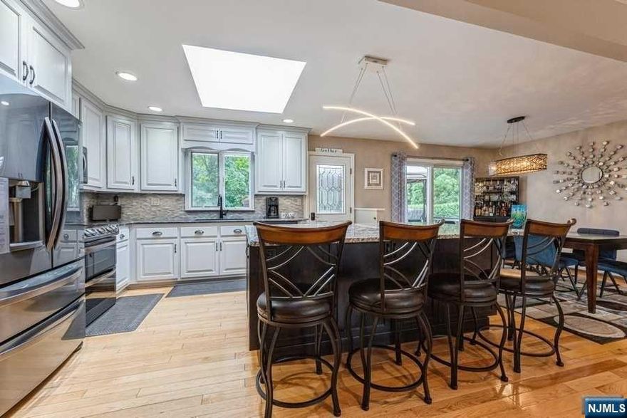 Light filled 4BR/3BA expanded and updated home in great neighborhood of Montvale features open floorplan perfect for entertaining. Updated kitchen with center island and skylight, granite countertops and blk SS appliances. Sliding door opens to large deck overlooking beautifully landscaped private fenced backyard with in-ground pool, hot tub and chic she-shed. Primary bedroom suite with whirlpool bath, skylight, 2 closets and a slider to the deck. Two additional BRs and updated full bath. Lower level includes family room, 4th BR and bath, laundry room, and access to oversized garage with workshop area and bonus room/gym. Whole house generator, sprinkler system, central AC and large driveway. Highly desirable school system, close to GSP and NYC transportation.