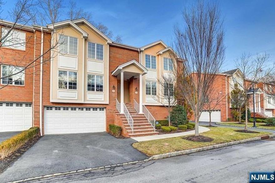 Spacious and beautifully appointed 3-bedroom townhome featuring 3.5 baths and a 2-car garage. This home offers hardwood floors, custom crown and panel moldings, and a bright open floor plan perfect for modern living. The custom kitchen includes granite countertops and stainless steel appliances, ideal for everyday living and entertaining. The full finished basement provides a spectacular family room or playroom along with a full bath, offering additional flexible living space. Additional features include central air, recessed lighting, central vacuum, and high-end finishes throughout. Located in a highly desirable town with Blue Ribbon schools, this home is conveniently close to shopping, major highways, and NYC transportation.