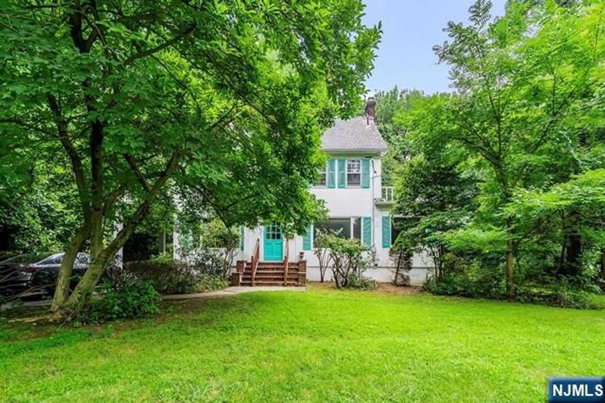 Discover the perfect blend of elegance and comfort in this expansive 3,100 sq. ft. Center Hall Colonial. As you enter, you'll be greeted by the classic charm of hardwood floors throughout, complemented by a grand foyer that leads into an inviting living area. The open and functional layout includes a spacious family room, sunroom, library/bedroom, formal dining room, a large kitchen with ample cabinetry. Each room flows seamlessly into the next, creating an ideal setting for both entertaining and everyday living. Upstairs, you'll find 6 bedrooms & 2 full bathrooms, providing plenty of room for a growing family. The expansive backyard providing a serene escape from the hustle and bustle of everyday life. Located near Downtown Palisades Avenue in Englewood, this property offers unparalleled convenience & easy access in NYC. With its blend of spacious living and a prime location, this home is a rare find.