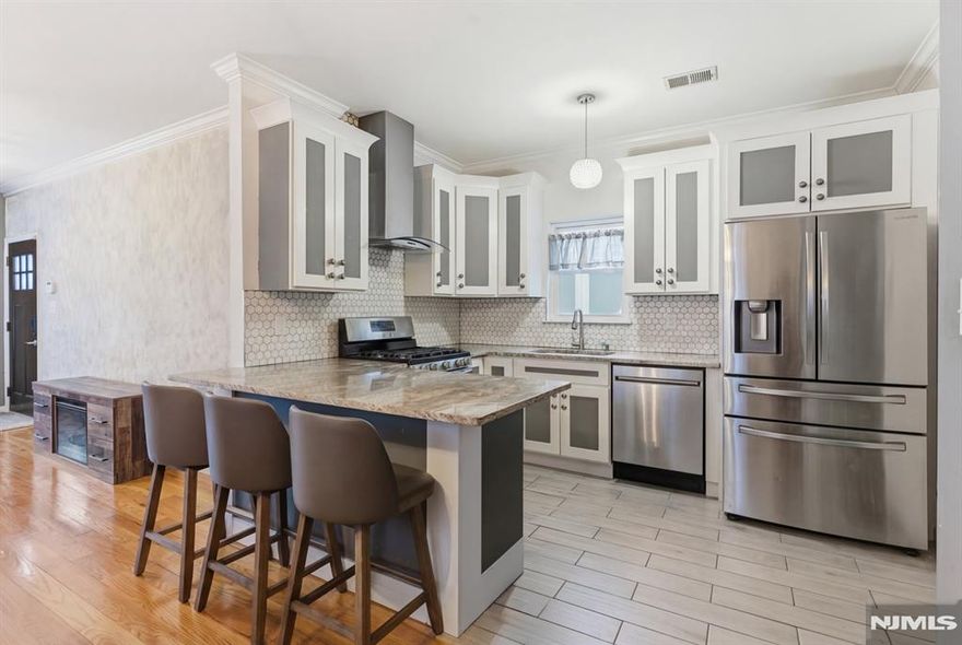 Newer-built semi-custom two-family located in a desirable section of Elizabeth. Well maintained with hardwood floors, central air, and open-concept living and dining areas. Modern kitchens, spacious bedrooms, and excellent natural light throughout. Ideal for owner-occupants or investors seeking a low-maintenance property with strong rental potential. Conveniently located near transportation, shopping, and major highways.