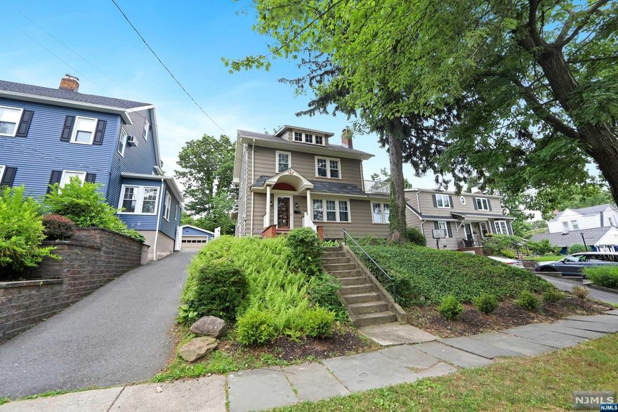 Charming side hall Colonial home in mint condition, situated on one of the most convenient locations of Rutherford close to NY/ NJ buses, school, and shopping area. First floor offers: Large living room, gas fireplace, sunroom with french door, formal dining room with sliding door leading to a large deck, eat-in kitchen and half bath. Second floor: Master bedroom with private terrace, two additional bedrooms and main full bath. Full walk-up attic for storage. Beautiful hardwood floor throughout, original chestnut trim and crown moulding. Full unfinished basement, utilities, laundry and storage. Gas heat, central A/C. Long driveway, large backyard great for entertaining.