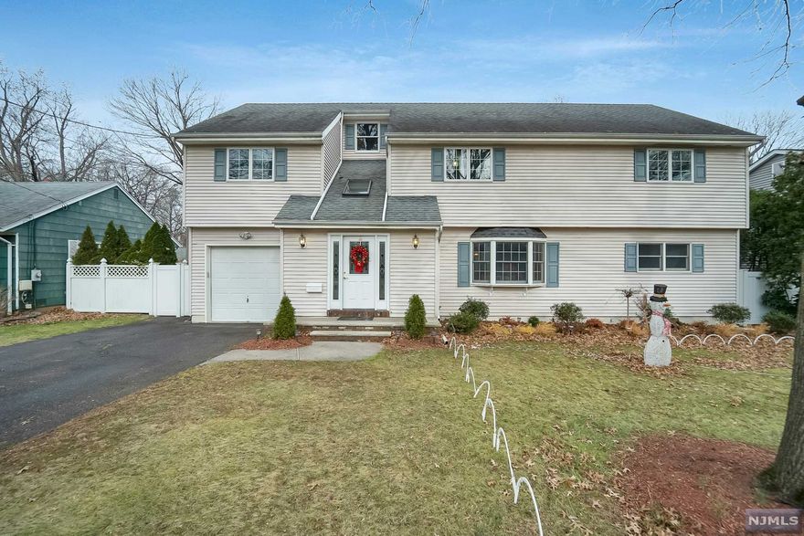 A real "turn-key" home that checks all the boxes! Great location! Minutes from elite shopping, dining, schools, parks and public transportation to NYC. Award winning schools. Welcome to this large and bright meticulously maintained colonial home. Boasting almost 2800 sq/ft of living space set on large leveled lot in the sought after neighborhood of Paramus. LOW TAXES and all that Paramus has to offer make this the perfect place to live. Inviting entry foyer with custom closets snd skylight. Mod Eat-In-Kit w/granite countertops and SS appliances. Formal Liv and din rm, 2 bed rms & a brand new full bath. 2nd flr offers en-suite with white Italian marble flr and skylight. 3 additional lg bed rms & a full bath. Large full finished basement boasts extra living space, laundry, utilities, storage and walk out to BBQ deck with electric awning excellent for entertainment. Privately fenced in yard with shed. New boiler & hot water is installed in 6/2021. Call today for a private showing.