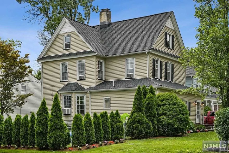 There is so much to love about this beautiful colonial in the desirable Yantacaw section of Nutley. This bright and spacious home offers three bedrooms plus a bonus room, which could easily be used as a fourth bedroom, and two, updated bathrooms. Upon entering the home, there's a sunroom for den or office space. The large living room leads into an elegant dining room with detailed trim and French doors. The eat-in kitchen boasts ample counter space and cabinets. High ceilings and hardwood floors flow throughout the house. The primary bedroom has a very large walk-in closet. Opportunity knocks to create a primary suite or add additional living space in the spacious walk-up attic. The fenced-in yard with new landscaping make this the perfect house for entertaining. Excellent schools and one block to the NYC bus. This house has it all.