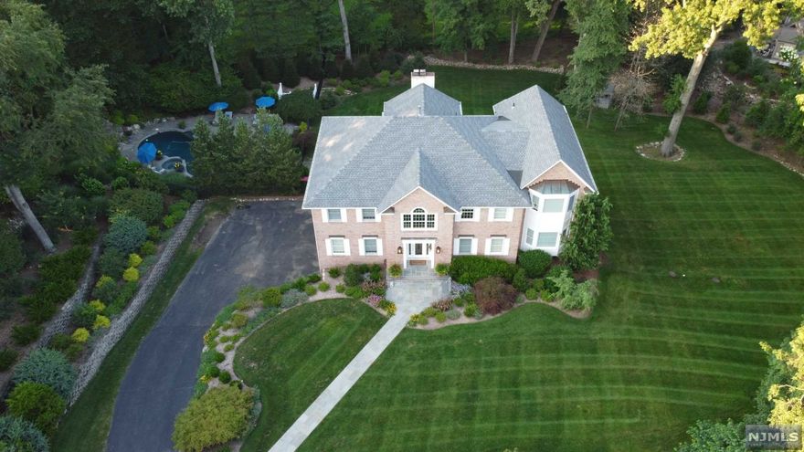 This Stunning 1.3+ acre resort-like property is located at the end of a cul-de-sac in Prestigious Franklin Lakes! Boasting a Private, Beautifully Landscaped expansive yard, including a new Heated Gunite Pool and Spa off to one side in a serene setting, highlighted by landscape lighting. Pool and sound are all completely operated by remote control, ready for entertaining. The home is a 5100+ SF (per the tax records) Renovated Center Hall Colonial with high ceilings and large 2 Story Foyer, Formal Living Room, Dining Room, New Kitchen w/Island, Quartz Countertops, Top of the line Appliances, Bar Area/Butler's Pantry off the Kitchen, Deck, 2 Story Great Room w/fireplace, Office/Den, Guest Ensuite Bedroom. Upstairs 4 large bedrooms including the Master Suite, set privately away, sitting room, fireplace and 2 WICs. Finished Walk-out Basement to patio and yard. 3 Car Garage.