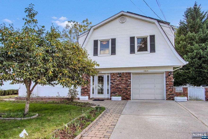 Beautiful Home with bright and open floor plan and gleaming hardwood floors, located on a cul-de-sac in Northvale. Welcoming foyer featuring French doors leading into a large family room with sliding doors to the backyard. Laundry room and half bath completes the first level. The second level offers an expansive living room including a large bay window with views of the lush Japanese Persimmon tree. Open dining room to an updated kitchen featuring wood cabinets, stainless appliances and breakfast bar/peninsula. On the third level you will find a large primary suite including an updated primary bath. Two large bedrooms and a full bath complete this level. Fully finished lower level including a large den with custom built-in closets. So much additional storage space. Solar panels all paid, and electricity is so low! Lush property offers a fenced-in yard with a Gunite in-ground Anthony Sylvan pool and large covered patio-Great for entertaining!You will absolutely love living here