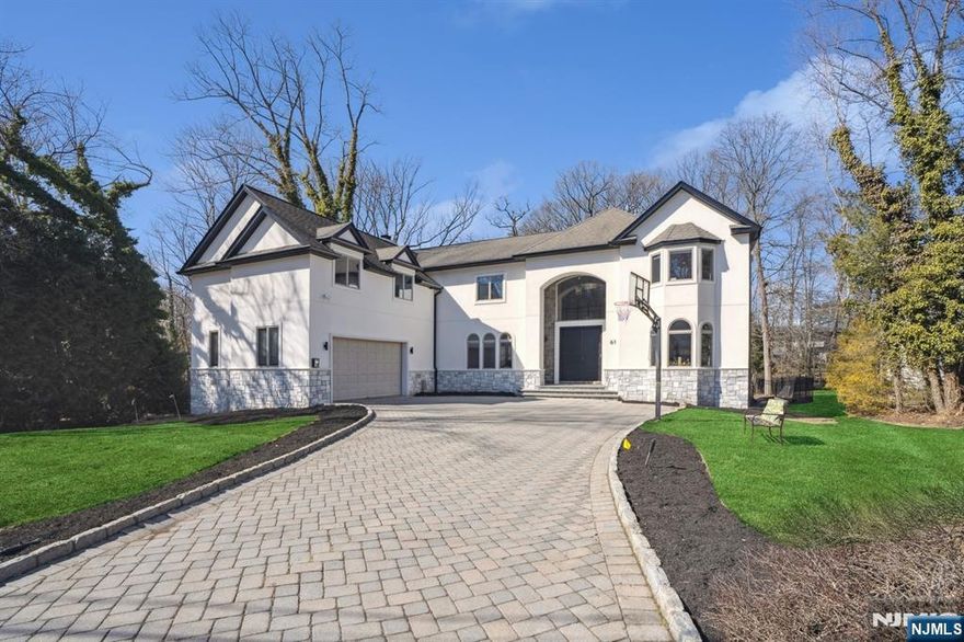Nestled on one of Tenaflyâ€™s most beautiful East Hill streets, this stunning estate sits on a half-acre lot and boasts over 8,000 sq. ft. of luxurious living space. As you enter, a grand double-entry foyer with soaring ceilings welcomes you into an open floor plan designed for both comfort and elegance. The main level features a formal living room/office, a powder room, a bedroom with a full bath, a formal dining room, and a spacious family room with a fireplace. The gourmet kitchen is complemented by a Butlerâ€™s pantry, a laundry room, and a two-car garage. The second floor offers five generously sized bedrooms and four bathrooms, including a lavish primary suite with his-and-hers walk-in closets, a private gym, and a spa-like en-suite bath. The lower level is an entertainerâ€™s dream, featuring two legal bedrooms, a full bath, a recreation area, a wine room, and a walk-out to a private backyard oasis with a heated pool. Offering incredible value, this home is a must-see!