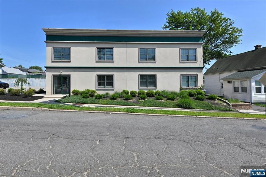 mixed use building. two residential apartments 2 br 1 bath each, newly constructed. 2500 sq ft of professional office space on first floor, fully leased. off street parking is ample.