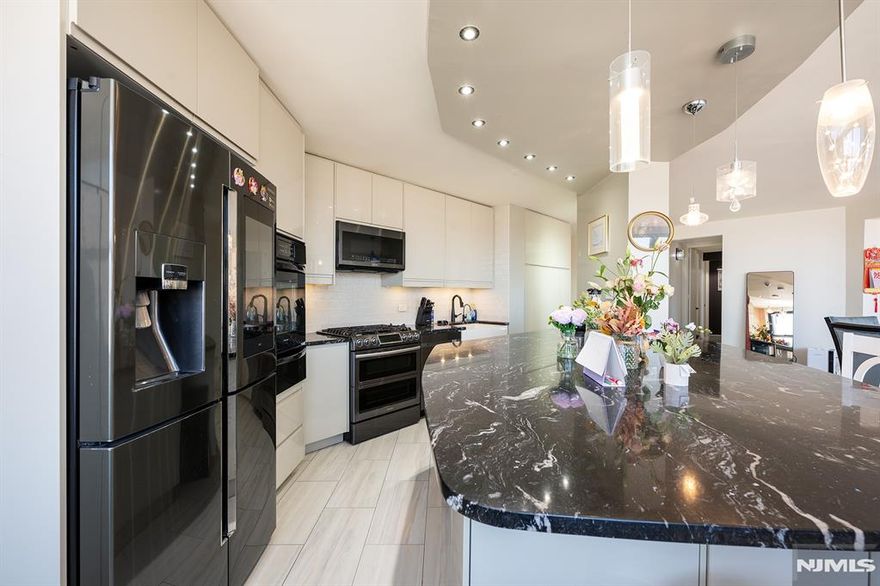 Perched high above the Hudson, this impeccably renovated residence at Galaxy Towers offers a rare blend of scale, sophistication, and sweeping skyline views. Spanning over 1,900 sq ft, the home is thoughtfully curated with designer finishes, bespoke details, and premium appliances throughout. Expansive living and dining areas are bathed in natural light, seamlessly connected to a chefâ€™s kitchen designed for both function and style. The primary suite serves as a private retreat, complete with an en-suite half bath, oversized walk-in closet, and a cedar-lined closet for elevated storage. Residents enjoy access to Galaxy Towersâ€™ full-service amenities, including 24-hour concierge, resort-style indoor and outdoor pools, fitness center, sauna, jacuzzi, tennis courts, and on-site conveniencesâ€”offering a lifestyle defined by comfort and ease. Garage parking available for $250/month. With effortless access to NYC, Hoboken, and Jersey City, with easy access to major highways. This residence embodies luxury waterfront living at its finest.