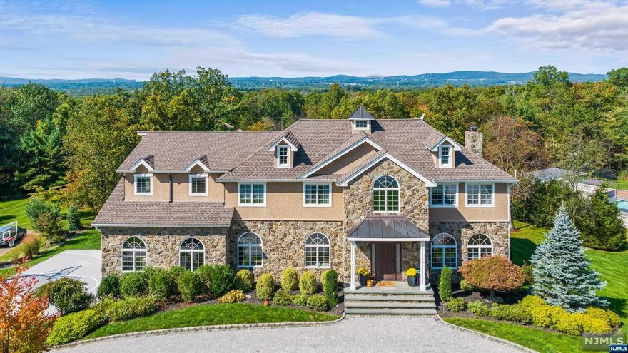 elcome to luxury living at its finest! Sprawling colonial offers an array of amenities that will delight even the most discerning buyer. Moment you arrive, you'll be captivated by the paver driveway leading to this magnificent residence. Outdoor entertainment is a breeze w/ sports court, fire-pit & Trex deck overlooking the in-ground heated 2-tier pool w/ water slide, hot tub & waterfall. Covered outdoor bar provides the perfect setting for hosting gatherings, complete w/ ample seating for guests to enjoy. Inside, the grandeur conts. w/ a 2 story foyer, hardwood fls & elegant arched doorways & windows. Cozy up by the gas fireplace in the den or entertain in the living & dining rm. An eat-in gourmet kitchen is a chef's dream w/ high-end appliances, lg center island & 2 built-in desks. Retreat to the 1st fl BR w/ full bath. 2nd level boasts 5 BRS, inc. primary suite w/ 2 walk-ins & bath featuring a jetted tub, stall shower & dual vanities. 2 full baths & laundry complete level.