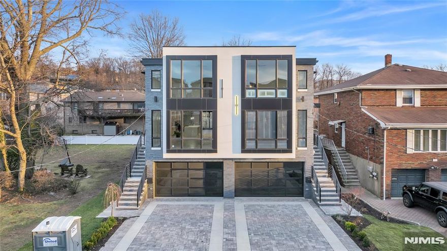 OVER-SIZED DUPLEX ON A OVER-SIZED LOT A ONE OF A KIND, 3900 SQ FT, BRAND NEW TOWNHOME BUILT BY MB CUSTOM BUILDERS. THIS LUXURIOUS HOME BOASTS 3 LEVELS OF LIVING SPACE. MAIN LEVEL- 9' CEILINGS, OPEN CONCEPT, LIVING ROOM WITH FIREPLACE,, DINING ROOM, MODERN EAT IN KITCHEN OVERSIZED ISLAND, GE CAFE APPLIANCES, AND UNDER MOUNT CABINET LIGHTING, AND FAMILY ROOM WITH FIREPLACE AND SLIDING GLASS DOOR TO DECK AND HALF BATH....2ND FLOOR-PRIMARY BEDROOM WITH FIREPLACE, WALK IN CLOSET AND 3 ADDITIONAL CLOSETS, OVERSIZED WINDOWS AND SPA LIKE BATH WITH HIS AND HER RAIN SHOWER , 2 ADDITIONAL JUNIOR SUITES WITH WALK IN CLOSETS AND LAUNDRY COMPLETE THE 2ND FLOOR. GROUND FLOOR- RECREATION ROOM WITH OFFICE, FULL BATH, SLIDING GLASS DOOR TO A NICE SIZE YARD, GARAGE, AND ENTRY FOYER....ADDITIONAL FEATURES-MULTI ZONE HEATING AND COOLING, CUSTOM MOLDINGS THROUGHOUT AND MULTI ZONE SPEAKER SYSTEM