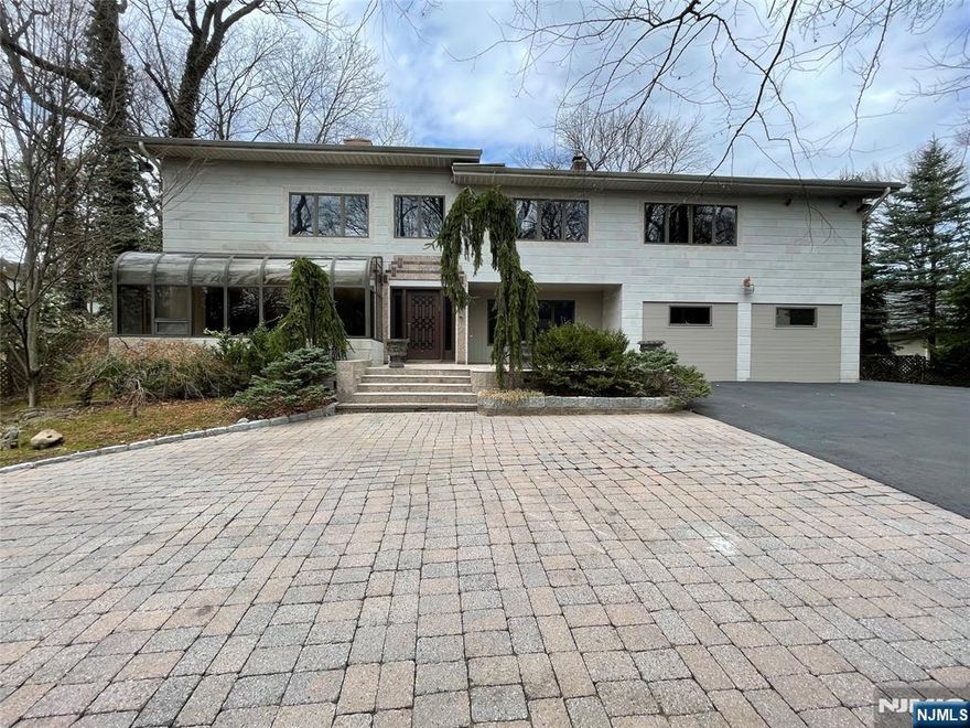 NEWLY RENOVATED CUSTOM SIX BR, SIX FULL AND TWO HALF BATHS CONTEMPORARY HOME ON .46 ACRES IN ENGLEWOODS PRESTIGIOUS EAST HILL NEIGHBORHOOD.FIRST FLOOR FEATURES GRAND FOYER,DEN/LIBRARY,FDR,LR W/SLIDERS OUT TO THE BACKYARD,HALF BATH,GOURMET KOSHAR EAT IN KITCHEN W/STAINLESS STEEL APPLIANCES,LARGE WALKIN PANTRY AND SLIDERS TO THE BACKYARD;IN ADDITION THERE IS A GUEST SUITE W/SITTING AREA,FULL BATH AND BEDROOM.EXQUISITE WINDING STAIRCASE LEADS TO THE SECOND FLOOR W/PRIMARY BEDROOM AND BATH + 4 ADDITIONAL BEDROOMS EACH WITH ITS OWN BATH. LOWER LEVEL FEATURES A LARGE REC ROOM, A STORAGE CLOSET AND STORAGE ROOM,EXERCISE ROOM,LAUNDRY ROOM AND FULL BATH.HOME HAS A FULL GENERATOR.CLOSE TO SHOPPING,HOUSES OF WORSHIP, PUBLIC TRANSPORTATION AND MINUTES TO NEW YORK CITY. A MUST SEE-IT WONT LAST!!!!!