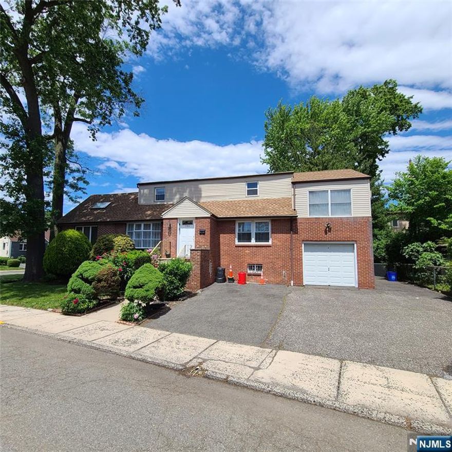 Well maintained one family home on a corner lot in Ridgefield NJ near shopping, schools, major highways, parks, and many other conveniences. Central Air/Heat, Hardwood Floors, Finished Basement with additional family room, office/den and full bath with walkout to the backyard, utility/laundry room. Plenty of closet space throughout.