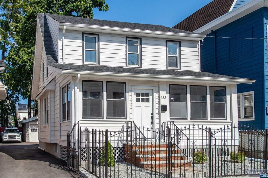 Welcome to your new haven of comfort and style! This single-family home is a gem that has been thoughtfully and meticulously renovated to offer you the best of modern living while preserving its original charm. Step inside to discover a stunning brand new kitchen and bath. As you explore the 1st floor, you'll be captivated by the exquisite original hardwood floors and woodwork, gracefully blending timeless character with contemporary convenience. The warm and inviting ambiance of the 1st floor will make you feel right at home from the moment you walk through the door. A brand new roof ensures peace of mind and protection from the elements. The electrical system has been fully updated to provide modern functionality and safety. Additionally, new siding adds to the home's curb appeal and enhances its overall energy efficiency. Don't miss the opportunity to make this your new home sweet home.