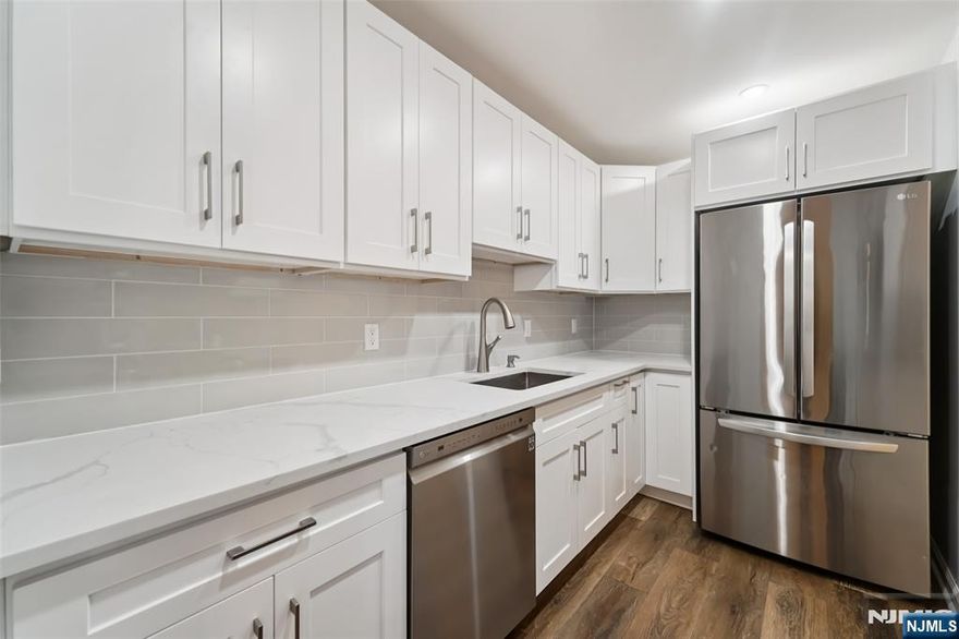 Welcome to this well-maintained, bright and spacious 1,064sq 2 bed, 2 bath(MBR/MBTH, BR, FBTH) east-facing unit located on the top floor of a mid-rise apartment building built in 2003. NEW Kitchen w/stainless steel appliances and upgraded bathrooms. This unit includes 2 covered parking spaces and a storage room. Storage and washer/dryer are in the same floor. SMART light and Thermostat can control with your phone. Plenty of visitor parking spaces. Security cameras on common area. Secured lobby. Convenient to shopping, school, transportation, high ways, express NYC transportation only one block away. The landlord has a NJ real estate license.