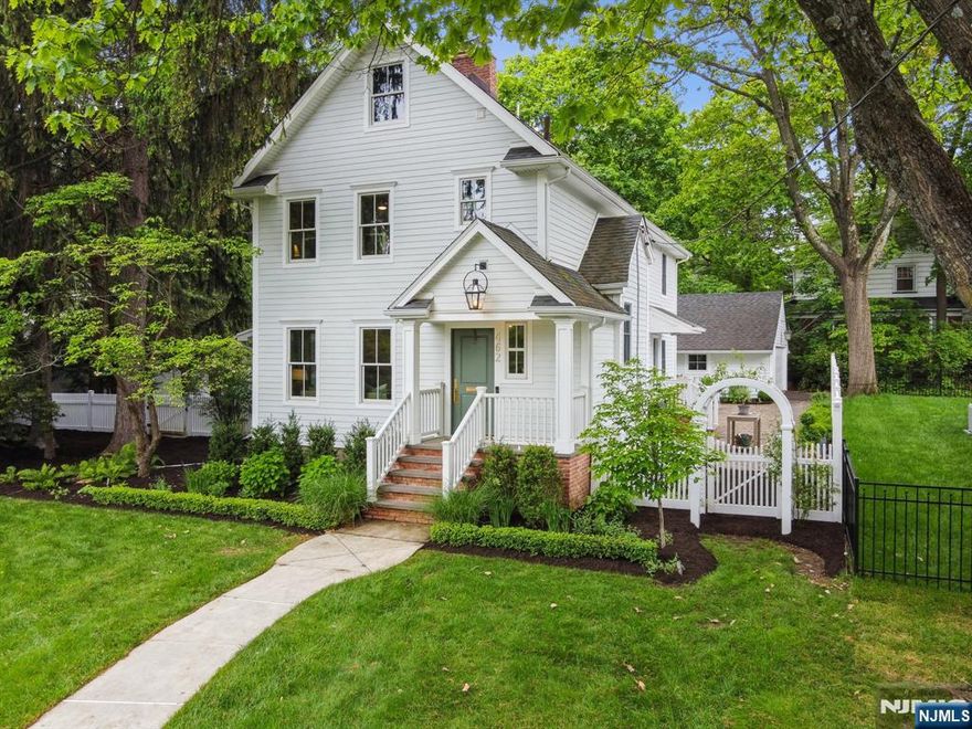 Welcome to 462 Grove Street your own slice of the Hamptons, without the drive. Just blocks from Uptown Montclair and NYC-bound transit, this light-filled home offers the perfect blend of peaceful chic and modern ease. Great layout throughout. The first floor is both functional and elegant, featuring a stylish new chef's kitchen, inviting family room with a gas fireplace and picture window out to the gorgeous backyard. Gracious living and dining rooms, a home office, convenient laundry area, mudroom, and a pretty, tucked away powder room. Upstairs, find three bedrooms including a luxe primary ensuite with a private sitting room, spa-like new bath, and dreamy walk-in closet. A beautifully renovated hall bath serves two additional spacious bedrooms. Enchanting garden with a lush lawn and a pea gravel patio ideal for dining under the stars or lingering over morning coffee. Renovated with care since 2019, including all new windows and Hardie siding, this home blends 1887 character with effortless contemporary living. Driveway access is on quiet Cooper Avenue. One block to beautiful Brookdale Park for the dog park, concerts, walking trails, pickle ball and tennis, and moments from Uptown's shops, eateries, and conveniences this is Montclair living at its most magical.