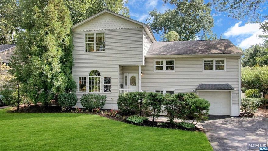 Nestled in the middle of a Quiet Tree Lined Street on the HoHoKus Border conveniently located to Top Rated Schools (Travell/BF), Parks, Shopping, Dining & NYC Transit (Train/Bus), this Expanded/Updated Spacious 2882sf Split Level consists of 4BR 3.5Bath across 5 Flrs of Living Space on .22Acre Flat Lot. EF welcomes guests to Open Concept Floor Plan flooded w/Natural Light. Formal LR & DR, both w/Palladian Windows, flow seamlessly into Vaulted GreatRm w/Gas FPL focal point & SGD to Raised Stone Patio o/lookn Fully Fenced Private Yard. Updated Kitchen appointed w/SS Appls, Glazed Maple Cabinets, Granite Counters, BuiltIn Pantry, BarStool Seating, Radiant Heat & French Door Access to Ground Flr featuring Den, PwdrRm & Lndry. MBR Ste on 3rd Flr offers Privacy & includes Office, WIC, Lndry & Spa Inspired MBath w/Radiant Heat & Skylight. Addtl Amenities: Alarm/Speaker/Sprinkler Systems & Water Softener. Meticulously Maintained showing True Pride of Ownership, this Gem is MoveIn Ready!