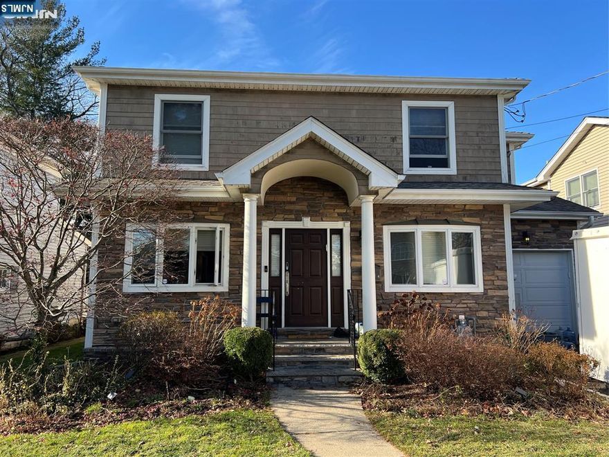 Perfectly located in Bergenfield on the border of Teaneck. This spacious five-bedroom, 3.5-bath home is truly move-in ready. The main living level offers an inviting layout featuring a bright living room, a banquet-sized dining room perfect for entertaining, and a large eat-in kitchen open to the family room. A one-car garage with mudroom and ample storage adds everyday convenience. The second floor features a generous primary suite with two closets and a full bath, plus four additional large bedrooms, two full bathrooms, and a conveniently located laundry area. The home also includes a full, unfinished basement offering endless possibilities for future living space, recreation, or storage. A fantastic opportunity in a prime Bergenfield locationâ€”donâ€™t miss it.