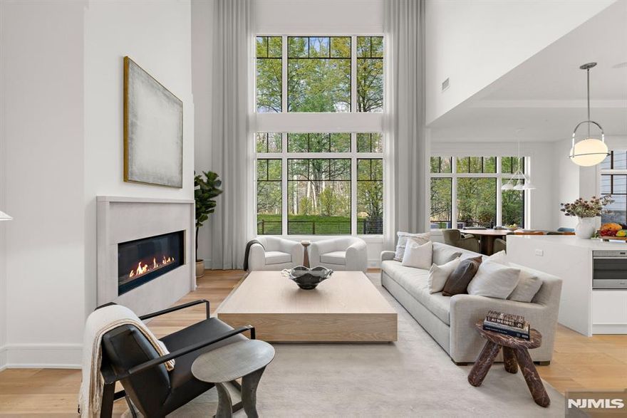 This exclusive, gated enclave of 24 newly constructed townhomes is perfectly appointed with resident clubhouse, fitness center and private pool. Situated amidst 15 serene wooded acres with breathtaking views of the esteemed Alpine Country Club, 16 Stone Bridge Court is a 'Buckingham' floor plan featuring 4 bedrooms, 4.5 baths, elevator and 2 car garage and driveway. Designer Kuche+Cucina kitchen with SubZero & Wolf appliance package, modern spa baths, 10'+ ceilings throughout, whole home generator, air filtration system, smart home technology and much more. Conveniently located minutes from Manhattan, shopping, entertainment and transportation. Developed in collaboration with Zampolin & Associates Architects and Rock Ridge Construction. At The Woodlands, luxury living and natural beauty come together in an unparalleled setting designed for those seeking the finest lifestyle.