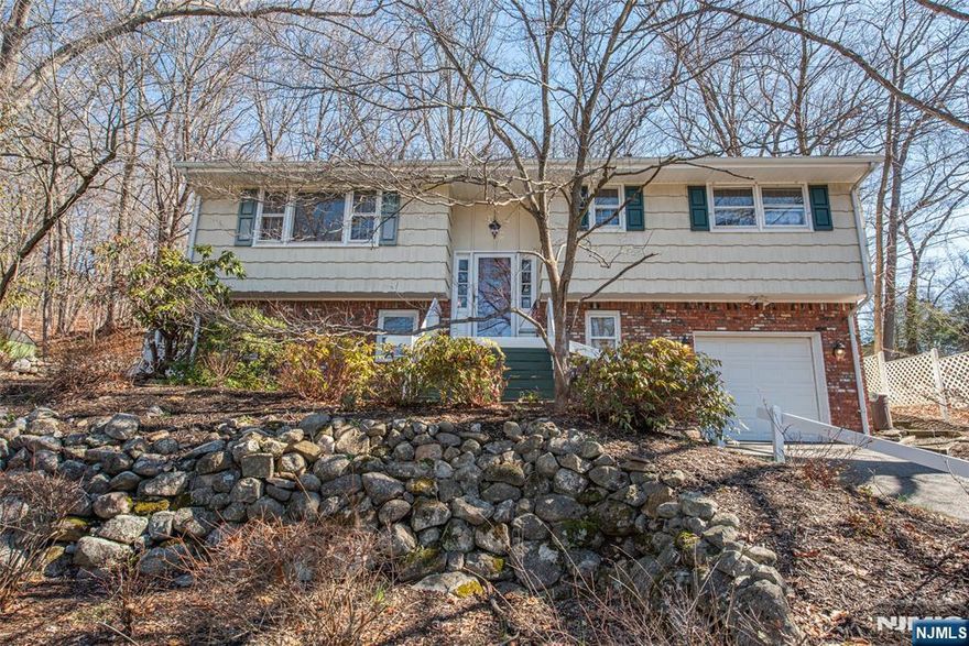 Welcome to this lovingly maintained, spacious and versatile 4-bedroom, 2-bath bi-level home nestled in the desirable Cupsaw Lake area. Featuring hardwood flooring throughout the main level, this home offers a warm and inviting layout with plenty of natural light. The upper level includes a comfortable living space, dining area, and an updated eat-in-kitchen with modern touches, while the lower level provides flexible living options perfect for a potential mother-daughter setup, guest suite, or extended living space. Recent improvements include a newer roof (2024), offering peace of mind for years to come. Step outside to enjoy a private backyard complete with a large wood deck ideal for relaxing or entertaining. Located in the sought-after Cupsaw Lake community, this home combines comfort, flexibility, and location. A great opportunity you won't want to miss!