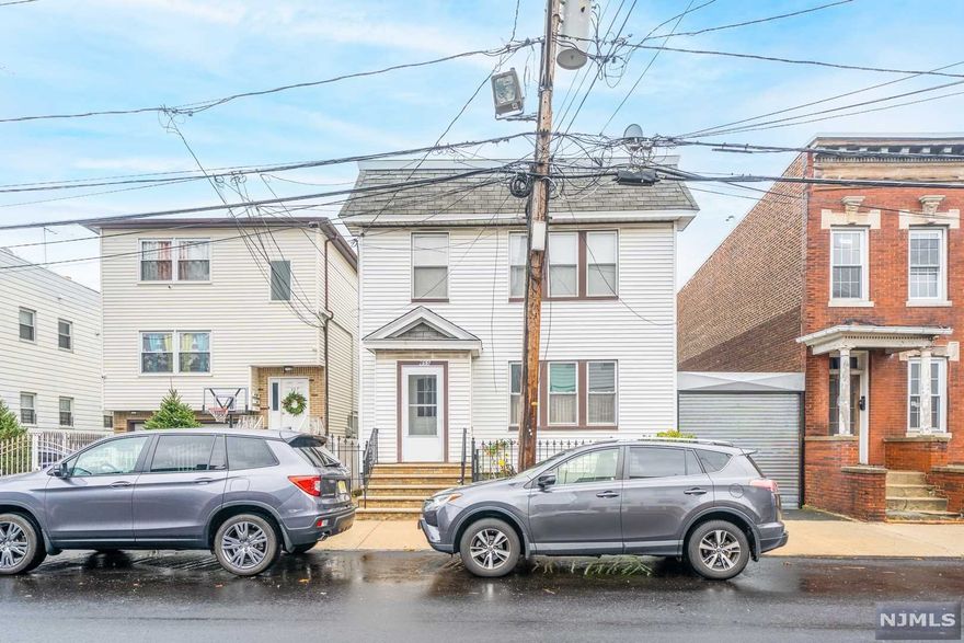 Terrific opportunity to own a well maintained investment property! Live in one unit, and rent the other - or use this solely as an income producing property! 2 Units with the same floor plan - each with 3 bedrooms, 1 full bath, kitchen and living room. Partially finished basement with lots of potential with washer/dryer and 1 full bath. This home also offers a lovely, private backyard and a garage for parking. An excellent opportunity you don't want to miss!