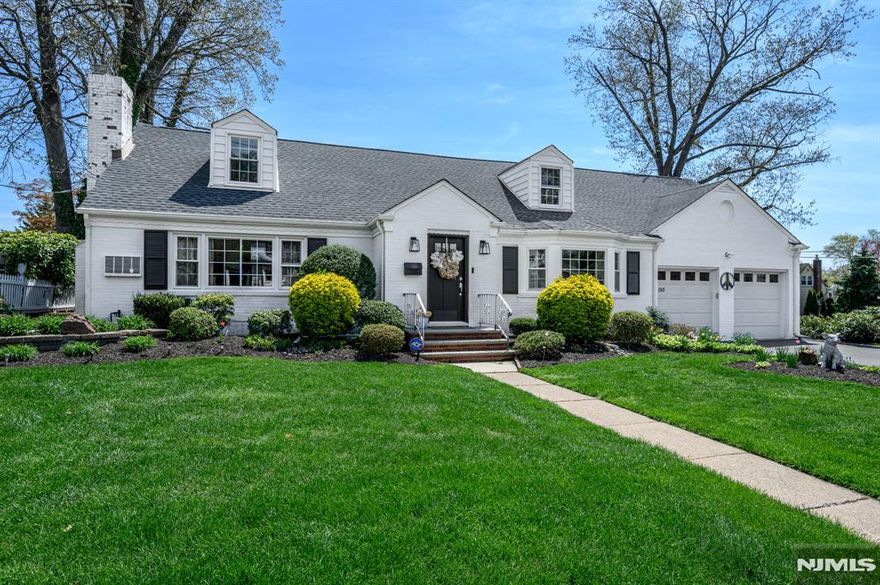 Beautiful 5 Bed 2.5 Bath Colonial with Finished Basement and 2 Car Garage in highly sought after Nutley is sure to impress! Well maintained on a large corner lot with plenty of upgrades all through, inc a remodeled kitchen, new roof, new windows & new hot water heater, just to name a few! Remodeled mudroom welcomes you in to find a light & bright open concept layout, with gleaming hardwood floors throughout. Formal living room features a large picture window and cozy fireplace. Formal dining room is adorned with elegant crown molding & wainscotting, along with bump out bay window with peaceful views. Beautifully remodeled eat-in-kitchen offers sleek SS appliances, granite counters with tiled backsplash, recessed lighting & large center island. Relaxing family room features french door access to the serene sunroom. Down the hall, 2 generous bedrooms with built-ins for accessible living, along with the main bath. Convenient laundry room, too! Upstairs, find the 2nd full bath, office, and 3 more generous bedrooms, all with new carpeting. Finished basement boasts a rec room with working bar, along with a 1/2 bath. Peaceful backyard holds a lovely patio for al fresco dining, and is completely fenced-in for your privacy and comfort, with new lawn sprinklers for easy maintenance. New exterior doors, solar panel savings, the list goes on! Just 2 blocks from Ratcliffe Elementary & a short stroll to both middle & high schools. Don't miss out! This could be the one!!