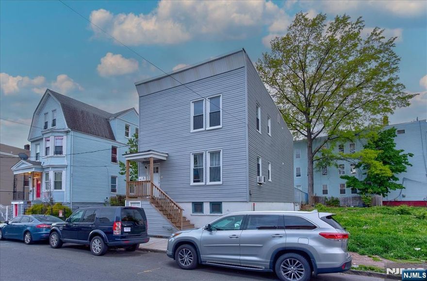 Experience this exceptional two-family residence where sophisticated design meets effortless living. Thoughtfully crafted with a spacious, open layout, this home is perfect for both everyday comfort and stylish entertaining. From soaring ceilings to gleaming hardwood floors, every detail reflects quality and elegance. Each unit features a beautifully appointed kitchen complete with stainless steel appliances, sleek countertops, and ample cabinetry that is ideal for both casual meals and hosting. Enjoy three generously sized, sun-drenched bedrooms and chic full bathrooms finished with modern fixtures and refined touches. Ideally situated in a highly desirable neighborhood near top-rated schools, shopping, and dining, this property offers both convenience and lifestyle. A rare and remarkable opportunity. Schedule your private showing today before it's gone