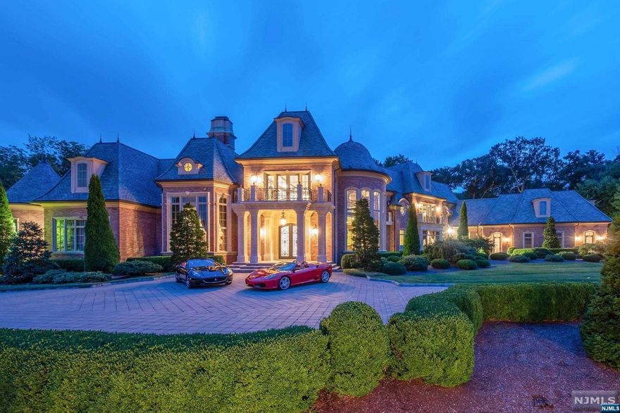 The most extraordinary 4.29 acre compound is now available for the buyer who will settle for nothing less than the best. Designed by renowned architect Bob Zampolin, this custom designed brick & slate 14,500 sq ft colonial manor estate is situated on a private double cul-de-sac overlooking the Ramapo Mountains. The list of amenities and features is extensive - starting with the grand hand-painted domed foyer and double staircase. Main reception rooms include a two-story great room with multiple balconies, billiards room, bar, music room, gourmet chef's kitchen with a backlit stained glass ceiling, formal dining room and living room and incredible home office. The grounds are spectacular and feature botanical garden landscaping, Olympic size swimming pool, and multiple entertaining spaces w/outdoor kitchen and paver patios. Crestron smart home system, heated paver driveway, high efficiency heating and cooling systems and elevator to all three levels. Only 30 minutes from NYC