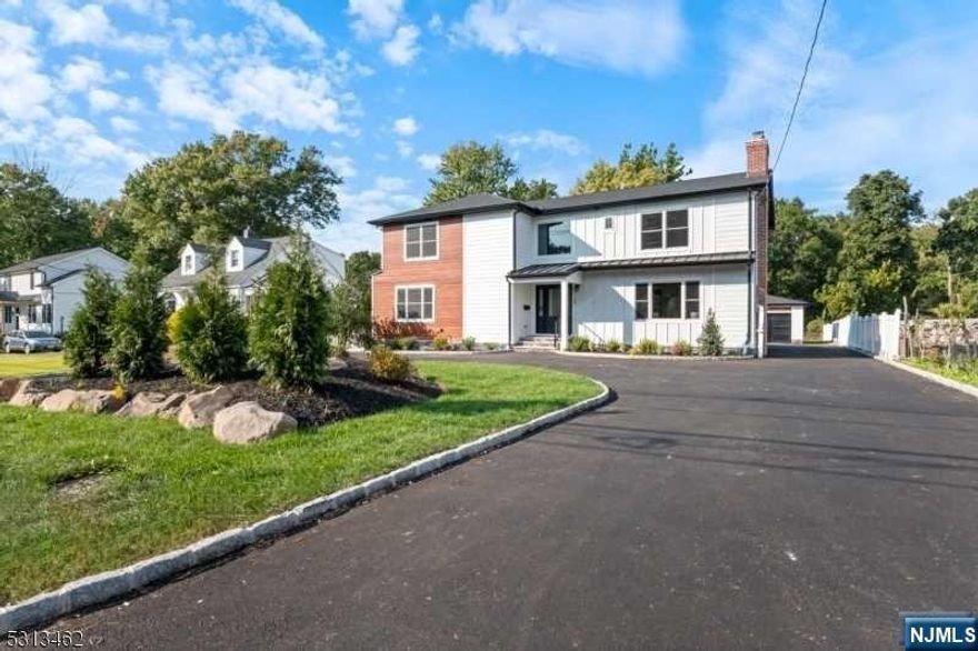 Welcome to this beautiful, completely renovated 5BD, 5.5 BA Colonial home situated on half an acre in the desirable Collins section of Livingston. The first floor greets you with a grand foyer leading to a spacious living room featuring an wood burning fireplace. The open floor plan continues with a dining room, family room and a large eat-in kitchen equipped with high end stainless steel appliances and a central island, both with sliders that open onto a deck overlooking the expansive backyard ideal for entertaining and outdoor activities. A versatile bedroom on this level includes an en-suite bath. A convenient powder room, panty and a mud room completes this floor. Upstairs, you'll find 4 well-sized bedrooms and 3 bathrooms, including a luxurious primary en suite with dual fitted walk-in closets. A convenient laundry room completes this level. The finished basement offers additional living space with rec room, office and a full bath. Decorate moldings, glass stairway.