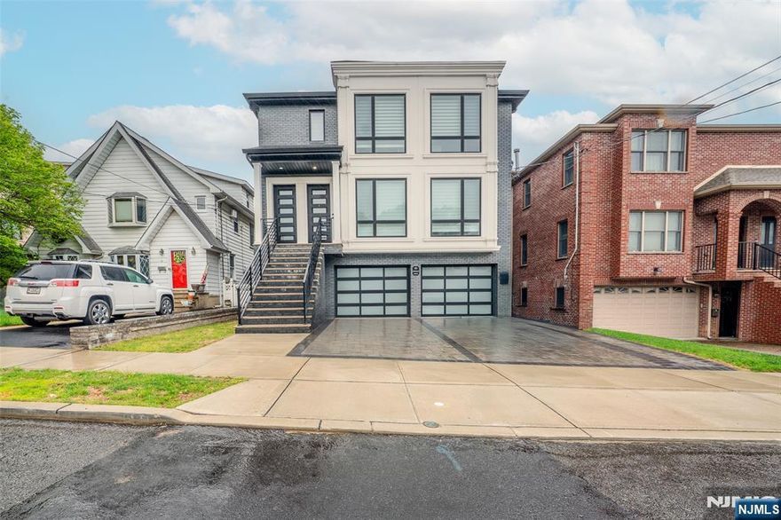 Impeccable first floor unit of a beautiful top/bottom two-family. This unit exhumes luxury and elegant aesthetics from top to bottom. In addition to the spaciousness of the unit with its high ceilings and generous sized bedrooms, this unit also comes with one garage parking along with excess driveway space for more parking. Location is unmatched as the home is walking distance from local parks, restaurants, shopping and NYC transportation.