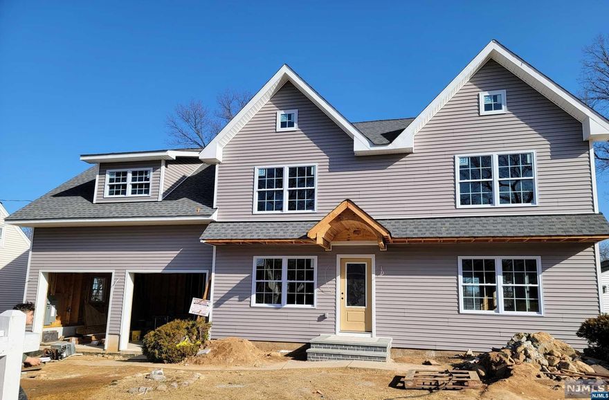 Soon to be amazing Contemporary Farmhouse on quiet Midland Park. The home sits on one of the largest lots in the area. 1st floor features a dream Chefs' Kitchen and semi-open floor plan. Large Dining Room area and multi-function Family Room/Den with gas Fireplace. Sliders to the Deck help bring the outside in. Powder Room and Laundry/Drop Zone with access to the 2 car Garage. 2nd floor delights with 3 roomy Bedrooms and full Bath, and a primary suite. Primary Bedroom has a dramatic tray ceiling, oversized Bath with soaking tub, walk in shower, and 2 separate vanities. A spectacular oversized walk-in closet completes this suite. Attractive financing is available.