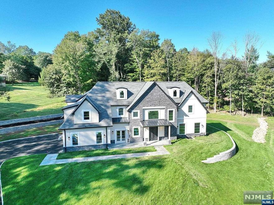 OPPORTUNITY KNOCKS! One of a kind architectural masterpiece - The Epitome of Luxury! GPS USE 87 Valley View Terrace! CUSTOM new construction Colonial Manor Home move-in ready. PRIVATE CuldeSac, coveted West Side of Montvale, private, peaceful escape! Stunning architecture, uncompromising quality! 5200 Sq.ft. plus 2000 SF lower lvl. Distinguished by 6 bedrooms, one on the main and five upstairs, 4 full and one half baths with extended family opportunity. Truly a trophy property w/open floorpln perfect for grand entertaining & comfortable living. Grand 2 story entry, soaring ceilings, postcard views, flooded with natural light. Delivered to you with expansive property & privacy will make your outdoor living dreams a reality! An exquisite living experience in the heart of Montvale with top rated schools, FAB shopping and EZ NYC Commute! All this and more in a desirable community. Check out our Special Features & Amenities and come tour this home at an attractive new price!