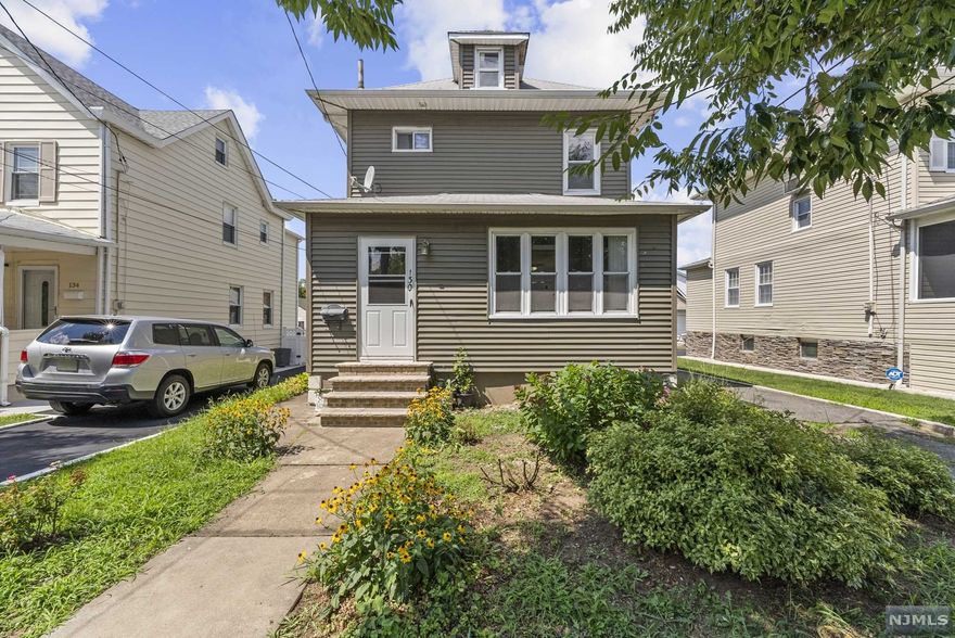 Welcome to this charming 3 bedroom 1 and 1/2 bathroom colonial style home in the middle of town. Walk in to your enclosed porch, perfect for your morning coffee. The home features and updated kitchen with hardwood floors all throughout, laundry conveniently located on the first floor. A detached 2-car garage with a driveway for up to 4 cars. A spacious backyard perfect for entertaining or gardening, your preference. Home is within a 6 minute walk to transportation directly into NYC Bus Terminal. Just a few minutes walk to city center with restaurants, salons, shops, house of worship, major highways and parks. Come see this one today.
