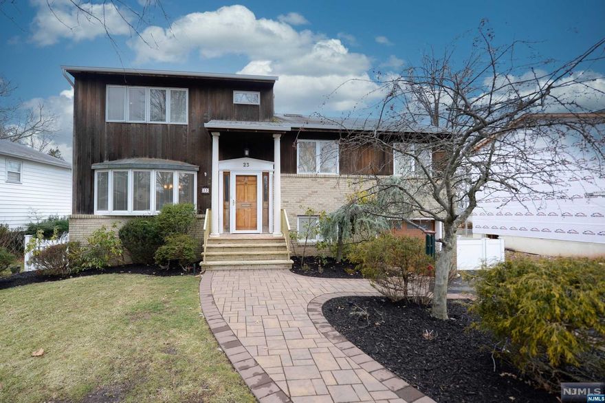 Welcome to this pristine tri-level split home in The Oaks neighborhood of desirable West Orange! Beautiful paver walkway leads you to the front entry w/ marble floors & a convenient powder rm. To your left, a formal dining rm w/ an abundance of natural light & plenty of space to entertain. The kitchen has custom cabinetry, granite countertops, SS appliances & double oven. An expansive living rm w/ beautiful hardwood floors, sky lights, a wood burning fireplace & french doors leading to the two tiered back deck complete the main level. On the second floor, the primary suite w/ impressive walk-in closet & en-suite w/ jetted tub & steam shower. Across the hall is the second bedrm w/ skylight & double closets. On the third floor, the third bedrm & second full bath. On the ground level is a newly renovated family rm w/ brand new half bathrm, laundry & walk out to the back yard. This level also provides access to the 1 car garage. The unfinished basement allows for plenty of storage.