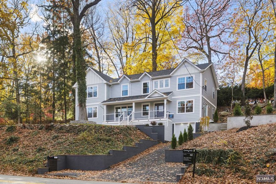 Perched on a beautiful hilltop and welcoming with a stunning Hardie Plank facade this colonial has been fully renovated w/love & impeccable style both inside & out! The interior has been transformed to include 4 bdrms, 2 f/2 h bth, designated office, central vac system, new hardwood floors & designer-level finishes. The brightly lit front covered porch opens into a breathtaking 15ft high foyer & open-concept 1st floor. The LR features a stone-covered gas fp surrounded by wainscoting, an office overlooking the expansive side yard & gas fire pit area, family room w/French door leading outside, impressive gourmet kitchen w/large waterfall island, range hood, wine cooler, pot filler, pantry closet & new SS appliances. In addition to the laundry room, upstairs are all bdrms & 2 f-bthrms including a master ensuite w/2 walk-in closets, spa-like shower w/bench, & HEATED FLRS! Full bth with Restoration Hardware finishes. 2zone central air, a finished basement that includes a hb.