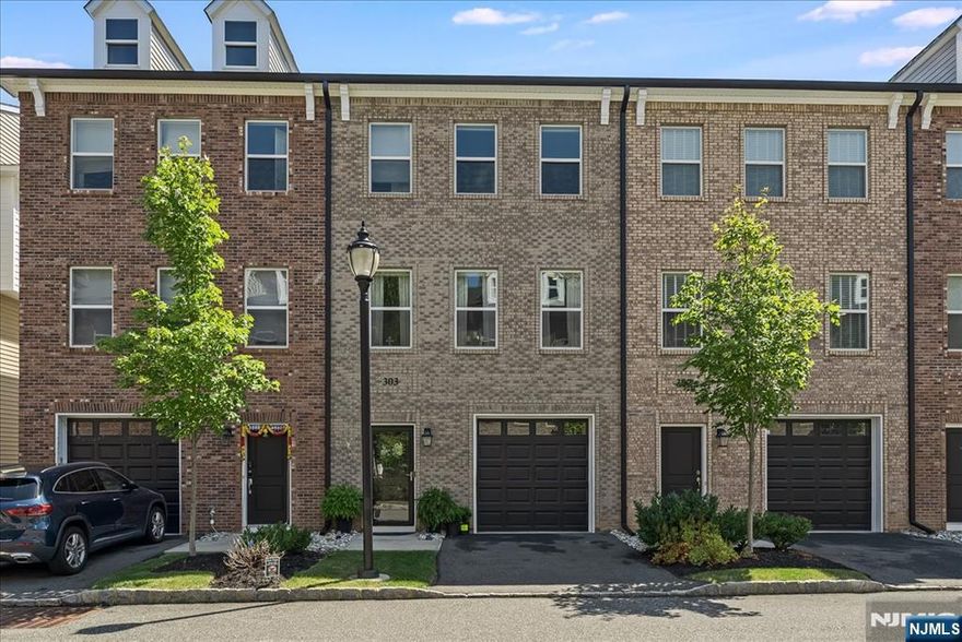 Step into a world where every detail whispers luxury and every day feels effortless. This 3-bedroom, 3.5-bath townhouse at The Abbe at Little Falls Station spans three levels of impeccable design, with soaring ceilings, wide-open living spaces, and exquisite custom woodwork and finishes that set it apart. The chef's kitchen flows seamlessly into sunlit dining and living areas, perfect for grand entertaining or quiet mornings. Retreat outdoors to two private decks or a custom paver patio designed for serene evenings under the stars. Upstairs, the primary suite offers spa-like tranquility, while versatile lower-level living creates endless possibilities. Beyond your door, the location is a commuter's dream just moments from Little Falls Station with direct train service to NYC, plus convenient access to buses and major highways. A vibrant downtown brimming with dining and shops completes the story. Here, life feels refined, worry-free, and beautifully complete.