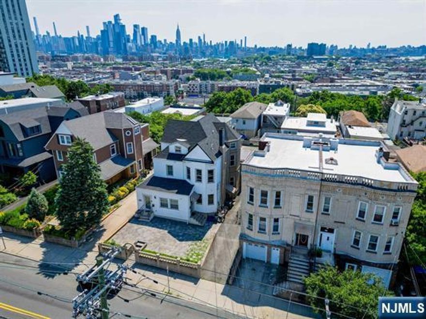 Incredible investment opportunity in this 3-Family home featuring DIRECT NYC Views from the supremely desirable Palisade Avenue in Jersey City Heights. All brick building with two decks for the upper-level units and a backyard for the exclusive use of the lower-level unit. Highly coveted off-street parking, with one-car garage parking and one car parking space in the driveway. Some renovations are in progress by the Owner, which could be stopped if desired and you could complete the renovations yourself as a new Buyer and completely customize everything to suit! Two units are currently vacant, making it perfect for an investor who would like to owner-occupy. Nearby to Washington Park for all your recreation needs, every shopping desire and all the famed eateries along the Central Avenue Special Improvement District, the arts and culture that surrounds you throughout the city, and all you could need and want. Jersey City, where the Hudson County world comes to live, work, and play!