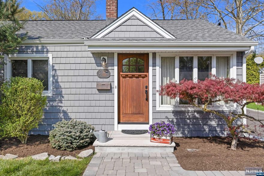 Welcome to 33 Delmar Ave, a recently updated, move-in ready home situated on one of the most desirable blocks in the neighborhood. Presenting an incredible opportunity for those seeking a modern and convenient lifestyle in one of NJ's top-rated school systems, this home is perfectly located in the heart of Cresskill. You are within close proximity to the elementary, middle, and high schools, steps away from the restaurants and shops of downtown Cresskill, and within minutes of local parks and the GWB. This beautifully maintained home boasts a brand new driveway, hardwood floors throughout, and an open concept floor plan that seamlessly blends the living, dining, and kitchen areas. Step outside onto the elevated deck, perfect for entertaining or enjoying a quiet evening after a long day of work. The property also features a large detached garage, offering ample space for parking and storage. With the potential to expand or build up, this home provides endless possibilities.