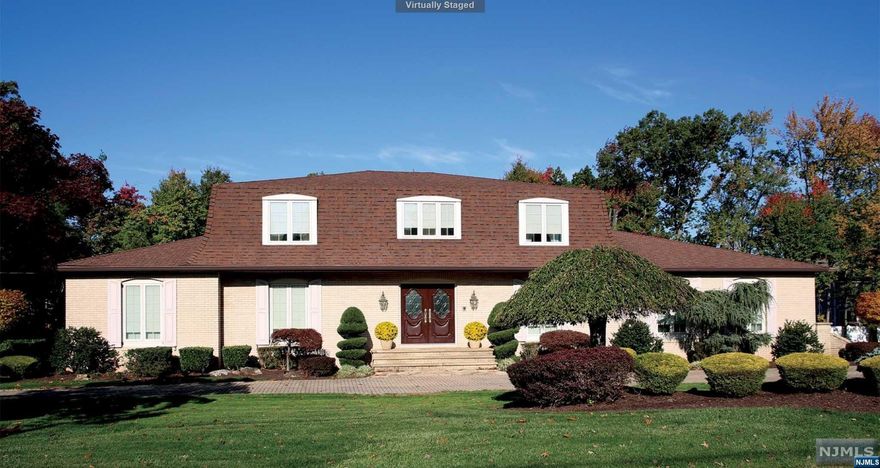 Create your own special memories in this beautiful brick Colonial in Dey Hill! The circular driveway welcomes you to this lovely home! The marble entry foyer features two beautiful Crystal Chandeliers and an exquisite staircase which embellishes the fine details that can be seen throughout this home. The center hall leads to the Living and dining rooms illuminating light from the large Pella Windows. The custom cherry kitchen features a Quartz Countertop, pretty backsplash, top of the line appliances, back staircase, dining area & is open to the Family Rm with a stunning stone fireplace! The family room also boasts gliding French pocket doors to the living rm, crown molding and sliding glass door to the Yukon gold flagstone patio! There are two Primary bedrooms suites - 1st or 2nd floor. Guest room, full bath, powder rm & laundry rm complete the 1st floor! Second floor features all very spacious bedrooms! The basement has tiled rec rm, summer kit, full bath & stairs to gar!