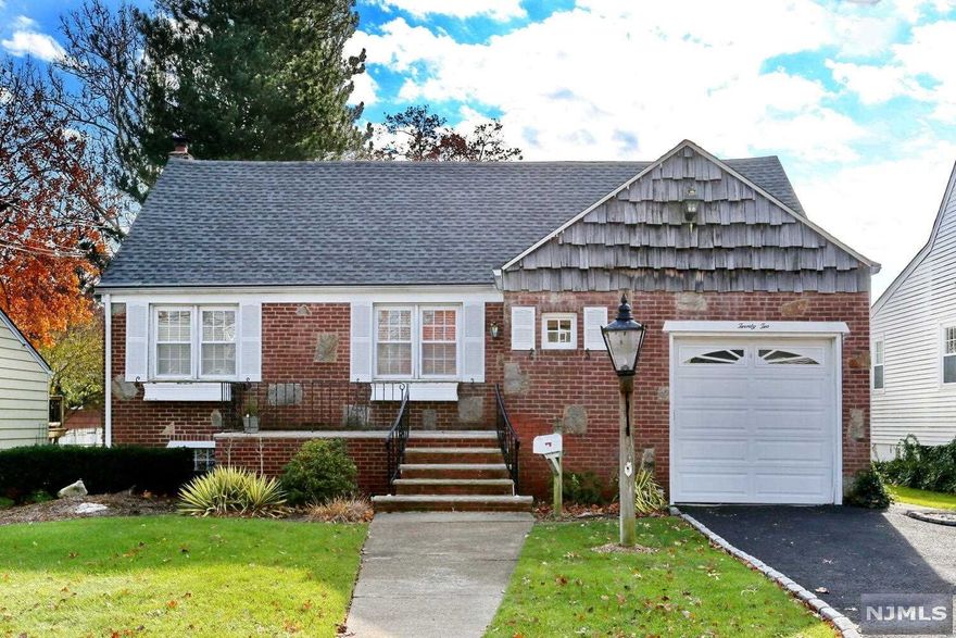 Look no further!...this expanded 3 bedroom Cape is immaculate from top to bottom. First enter the large living room which is perfect for entertaining, the kitchen has been tastefully updated with beautiful cabinets and granite counters. Off the kitchen you have a fantastic dining area with a custom built-in and direct access to the private backyard with large deck, electric awning and gazebo...the ultimate backyard for family barbeques; the 1st floor is finished off with a full bathroom and a ground floor bedroom. The 2nd floor has a gorgeous Master Bedroom with custom wainscoting and closet with built-ins. The full bath has a generous double sink vanity and the second bedroom upstairs is also very spacious; 2nd floor is complete with extra hall closets and additional attic storage. The basement has great family/rec space with a gas fireplace and laundry room. Central air, Jefferson School district, walk to NYC trans and the list goes on and on...don't miss it!