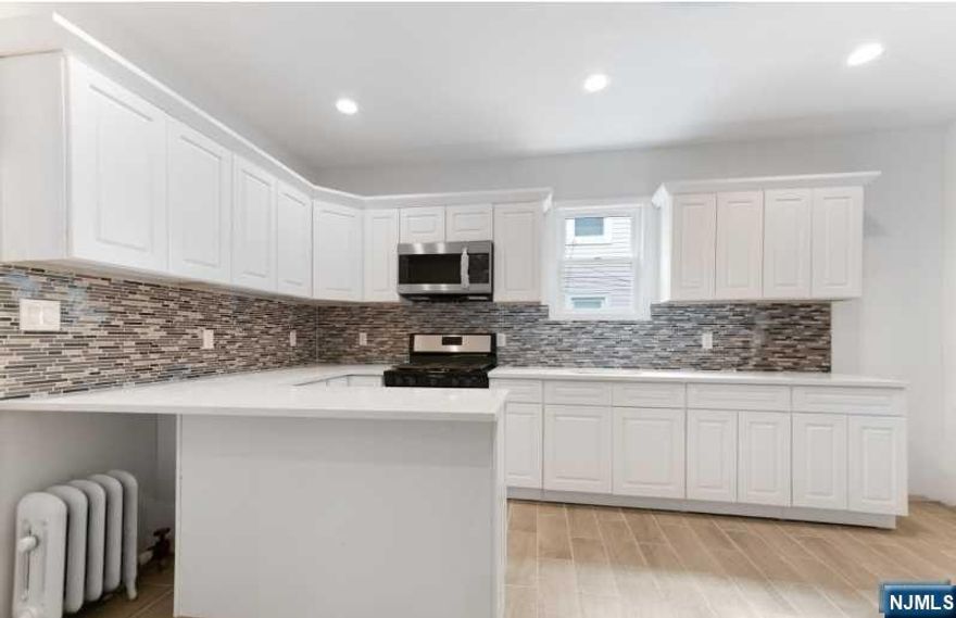 Beautifully renovated colonial home in a super convenient neighborhood of Newark! Local to all transportation, commuting, shopping, entertainment, schools and universities! This gorgeous home has 3 bedrooms, a large living room, a spacious dining room, fully finished BONUS ROOM attic, brand new modern kitchen with stainless steel appliances and granite countertops, 1 new full bath, 1 new half bath, fabulously restored hardwood floors throughout, recessed lighting, newly painted exterior, BRAND NEW ROOF just 3 months old, huge front porch and plenty of natural light throughout! Don't miss your opportunity to own this amazing new home!! MOTIVATED SELLER!! Seller's concession considered. Special lower interest rate financing available! Please inquire for more information. (Pictures coming soon!)