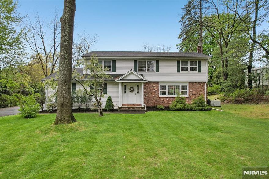 Beautiful Waterfront Setting! Welcome to this beautifully maintained Colonial home., offering timeless charm and exceptional space on a stunning 1.2 acre park like property. Built in 1965 and spanning 3200 sf, this 4 bedroom, 2.5 bath home combines classic design with serene waterfront living. A gracious entry foyer sets the tone, leading to spacious sun filled rooms enhanced by hardwood floors throughout. The expansive kitchen is the heart of the home, featuring a center island, ample cabinetry, and a bright dining area with picturesque views of the private pond, perfect for everyday living and entertaining alike. The impressive Great Room is a true highlight with a wood burning fireplace and sweeping views of the water. creating a warm and inviting atmosphere year round. Upstairs, the Primary suite offers a peaceful retreat with walk in closet and private bath, with jetted tub and stall shower. There are also three additional generously sized bedrooms and a full bath Outdoors, enjoy 125' of private waterfront surrounded by mature landscaping - your own tranquil escape just steps from your door! All this in the sought after town of Wyckoff, Close to Schools, Town and NYC Transportation. Additional features include: Whole house generator, Irrigation system, water softener, Furnace 2021, H/W Heater 2022 and so much more... ** Only small portion of property by the pond is in flood plan*** ** No Flood insurance**