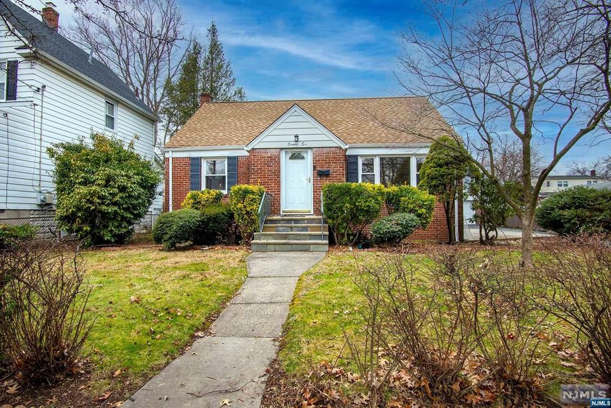 Just move in to this solidly built and recently renovated home boasting a brand new kitchen, new full bath with porcelain tile, new flooring, recessed lighting, new hot water heater and an oversized garage. Walk to Grant School, restaurants, shops, and NYC buses. Exceptionally maintained inside and out! Be in before the summer!