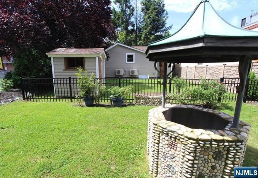 Very rare opportunity to live in a cottage style house in Tenafly! Enter the iron gates to the private front patio. A great place to sit and relax outside. The 1st floor is a studio style layout all updated with new kitchen, flooring and full bath. Downstairs features a full level which could be used as a bedroom or family room. A walk in closet and walk out is included in the lower level. Enjoy full use of the fenced in private back yard and close proximity to NYC bus transportation, shopping and great downtown. Tenant will have use of the private parking lot and coin laundry in the adjacent building to use. Utilities included!