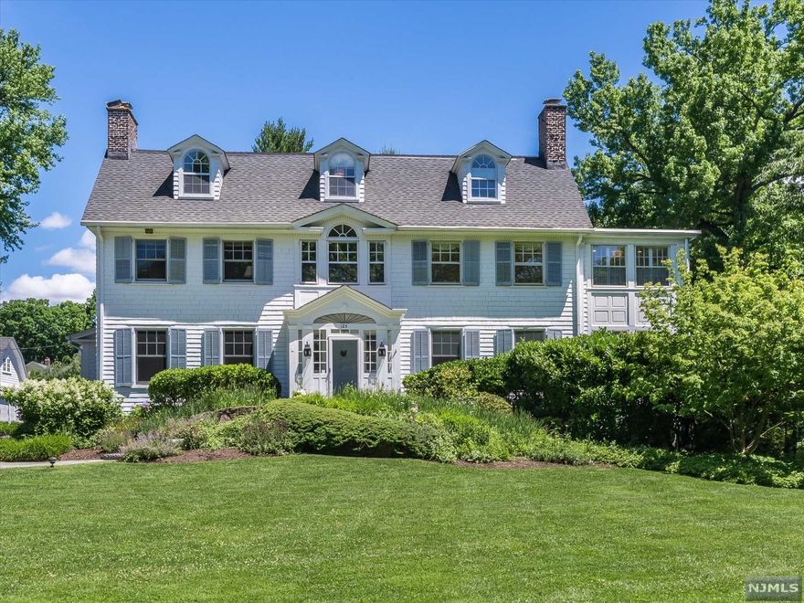 Gracious Colonial on over an acre of manicured land w/ putting green & terrace overlooking the heated pool. 5877 square feet of elegance throughout this 7 BR, 5.2 BA home. All new light fixtures and carpet runners, chef's kitchen with center island, high-end appliances, walk-in pantry, butler's pantry, incredible mud room with travertine tile, large, elegant dining room with marble gas fireplace and built-in corner cabinets, large, double living room with fireplace, family room and screened in porch. The second floor has 4+ BR 4 Full BTH, laundry, 2 offices.. Primary BR includes a dressing rm, bath &lots On 3rd FL 3 BR, Full BA, Storage. finished basement with powder rm, 2 W/D, and rec room. Indoor/Outdoor Sonos, Security, CAC, Generator, sprinkler system & nearby NYC transportation. Close to it all in Up. Montclair Village!