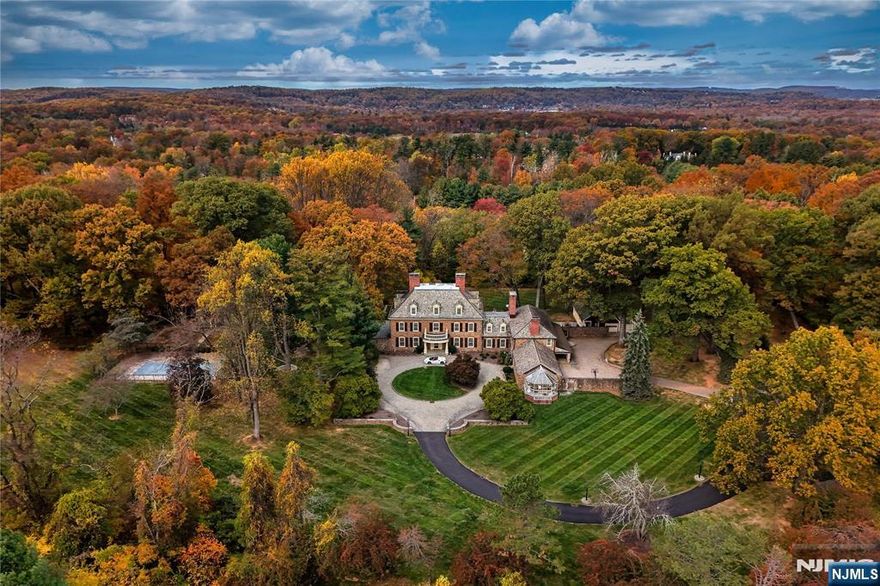 This extraordinary estate sits on approximately 6+ private acres and offers over 13,000 square feet of refined living space. The main level welcomes you with an impressive foyer featuring a 3-story grand staircase. A gourmet eat-in kitchen features stainless steel appliances, a large walk-in pantry, and direct access to outdoor sitting areas. The formal dining room is perfect for hosting intimate dinners or grand gatherings alike. A warm and cozy sitting room with a large wood-burning fireplace provides a relaxing retreat, while the family room offers a comfortable space for lounging or movie night. An incredible office with its own fireplace exudes timeless character, and a grand formal living room, complete with another fireplace, creates an impressive backdrop for entertaining. A second office with an additional powder room provides flexible space for work or study. The primary suite spans the entire left wing of the home. The bedroom features its own fireplace, dual walk-in closets, and a spa-inspired bathroom with double vanities, an expansive shower, and a soaking tub positioned beside a fireplace for ultimate relaxation. Four additional en suite bedrooms, a gym, and a laundry room complete this level. The upper level hosts two additional en suite bedrooms and a generous storage area, maintaining the homeâ€™s sense of comfort and scale. A resort-style pool sits beside the cabana, which includes a full bathroom, kitchen, recreation area, and storage.