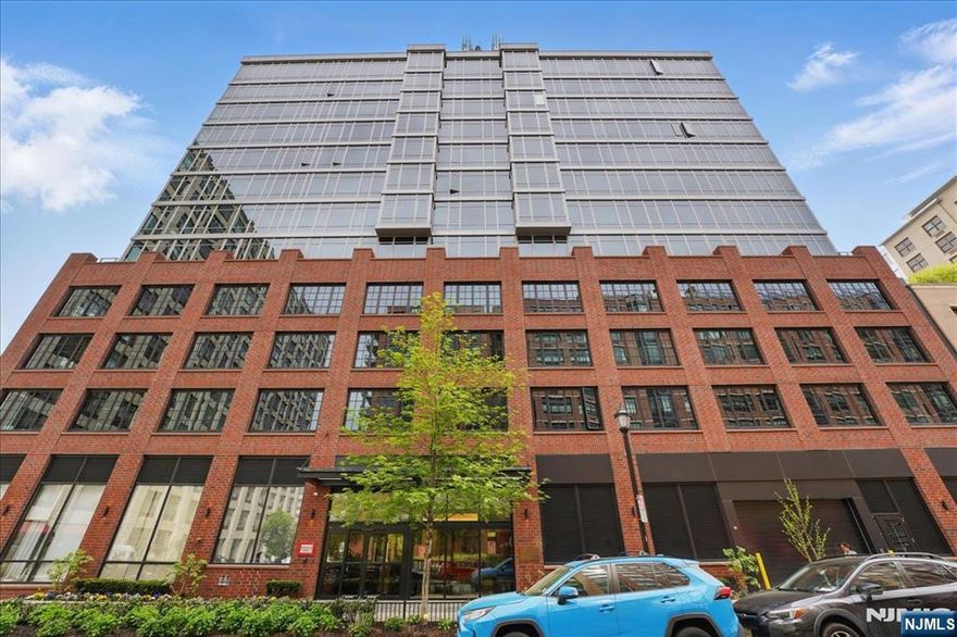 Welcome to 1425 Hudson St #6C in one of the newest Toll Brothers buildings in Hoboken waterfront, a bright and spacious 1-bedroom, 1-bath home. This west-facing condo features floor-to-ceiling windows, wide-plank hardwood floors, and an open living/dining area filled with natural light. The modern kitchen is outfitted with quartz countertops, custom cabinetry, and premium Thermador appliances. Additional highlights include a spa-inspired bath, in-unit washer/dryer, central air, and generous closet space. Residents enjoy full-service amenities including 24-hour concierge, fitness center, playroom, and a rooftop terrace with grills, plunge pool, free shuttle to path and stunning Manhattan views. Just steps from the ferry, parks, and vibrant Washington Street dining and shopping.